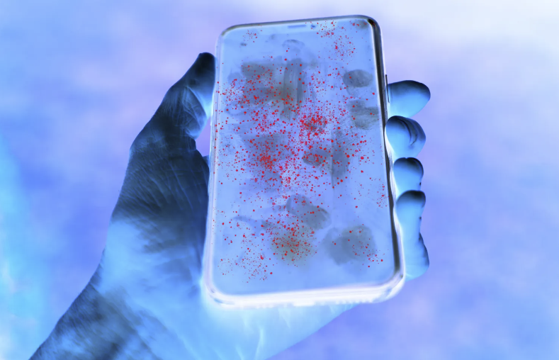 dirty phone being held under a uv light
